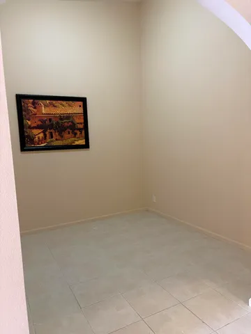 a bedroom with a bed and a night stand