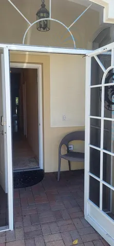 a view of a livingroom with furniture and door