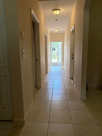 a view of a hallway with a door