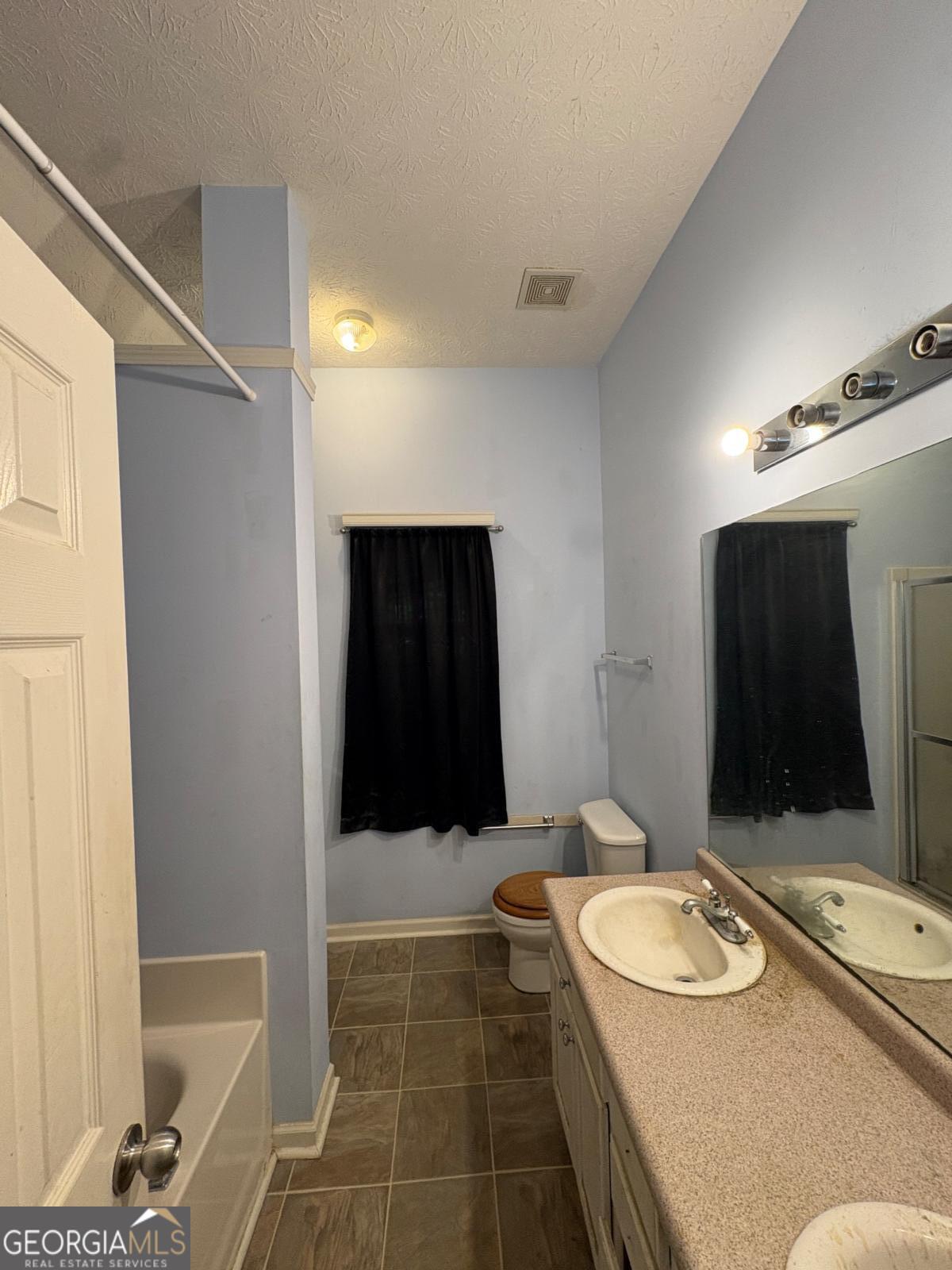 205 Boulevard Street Cleveland, GA 30528 - Photo 15 of 26 Master Bath suite with separate tub and shower dual sink