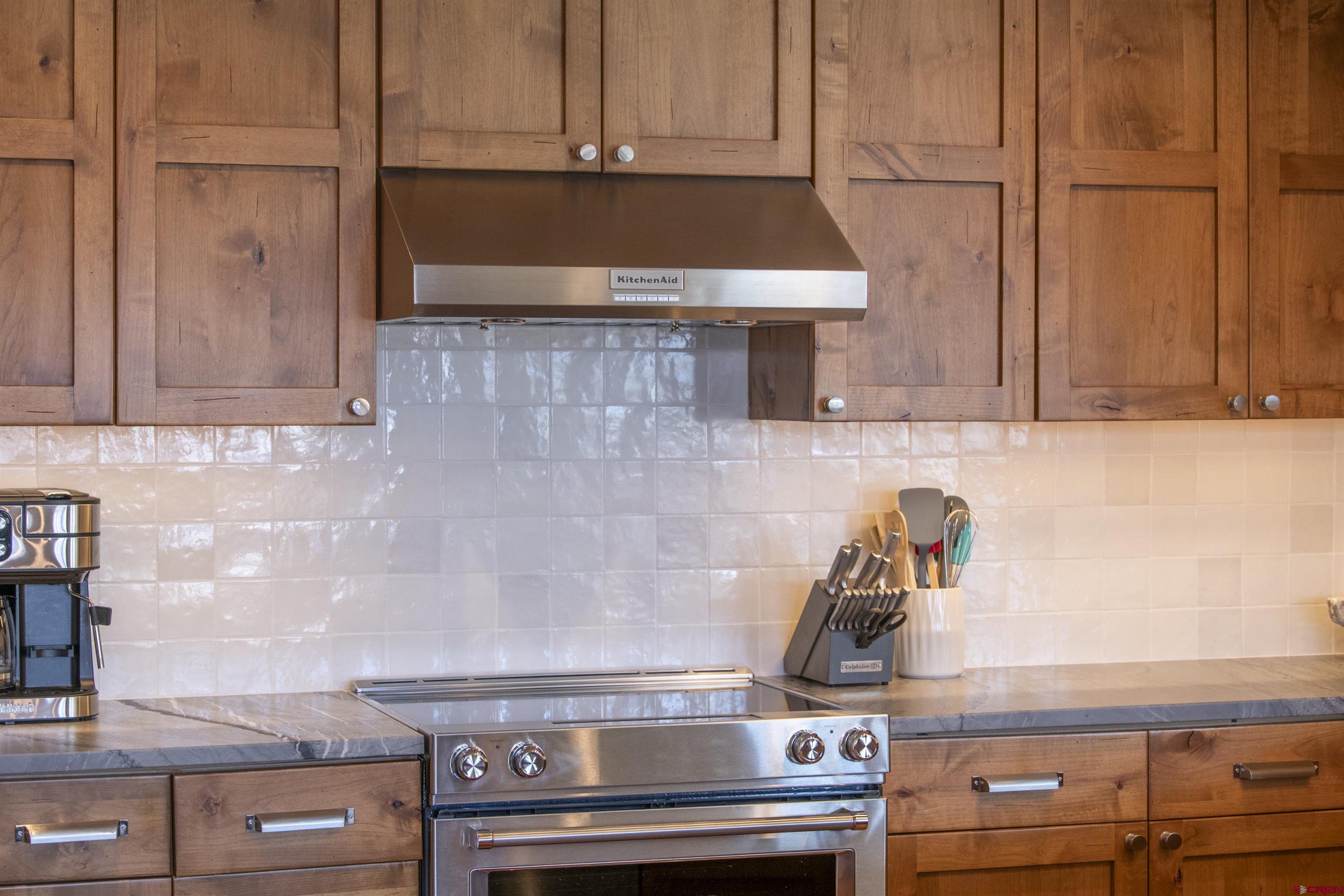 14 Hunter Hill Road, Unit C202 Crested Butte, CO 81225 - Photo 11 of 35 a kitchen with a stove and a microwave