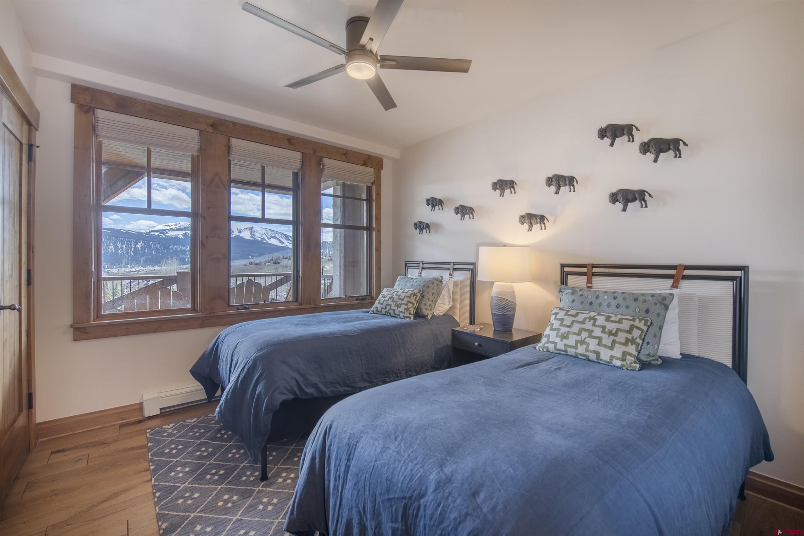 14 Hunter Hill Road, Unit C202 Crested Butte, CO 81225 - Photo 18 of 35 a bedroom with a large bed and a window