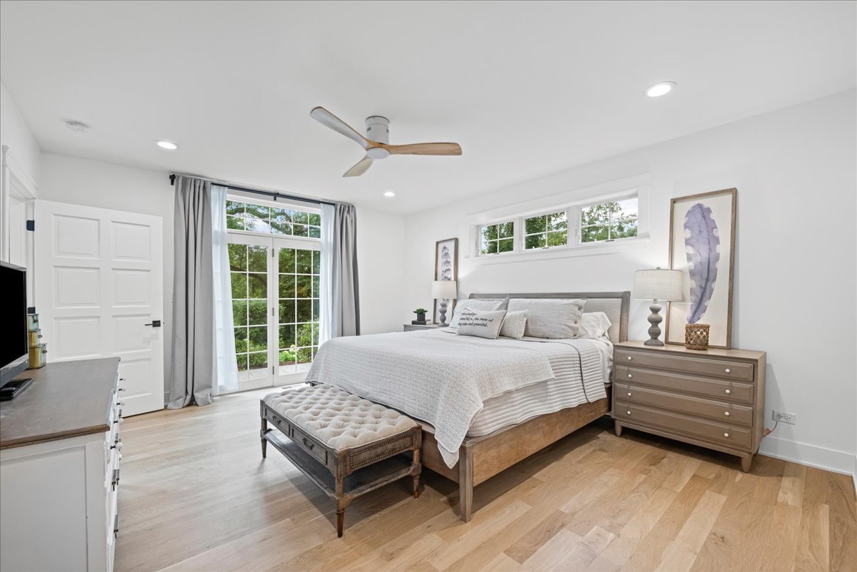 204 Country Commons Road Trout Valley, IL 60013 - Photo 17 of 58 a spacious bedroom with a bed table and window