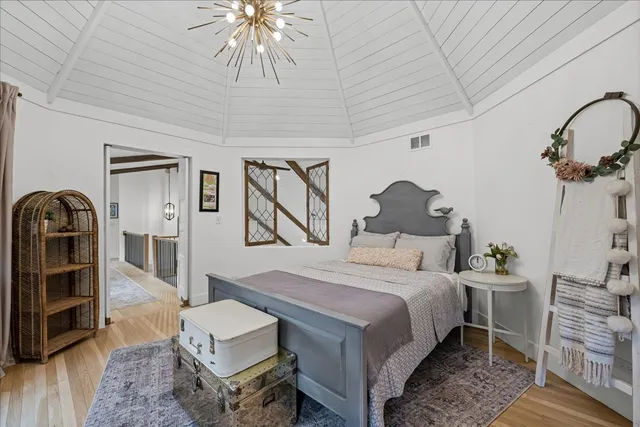 a view of a livingroom with furniture window and a kitchen