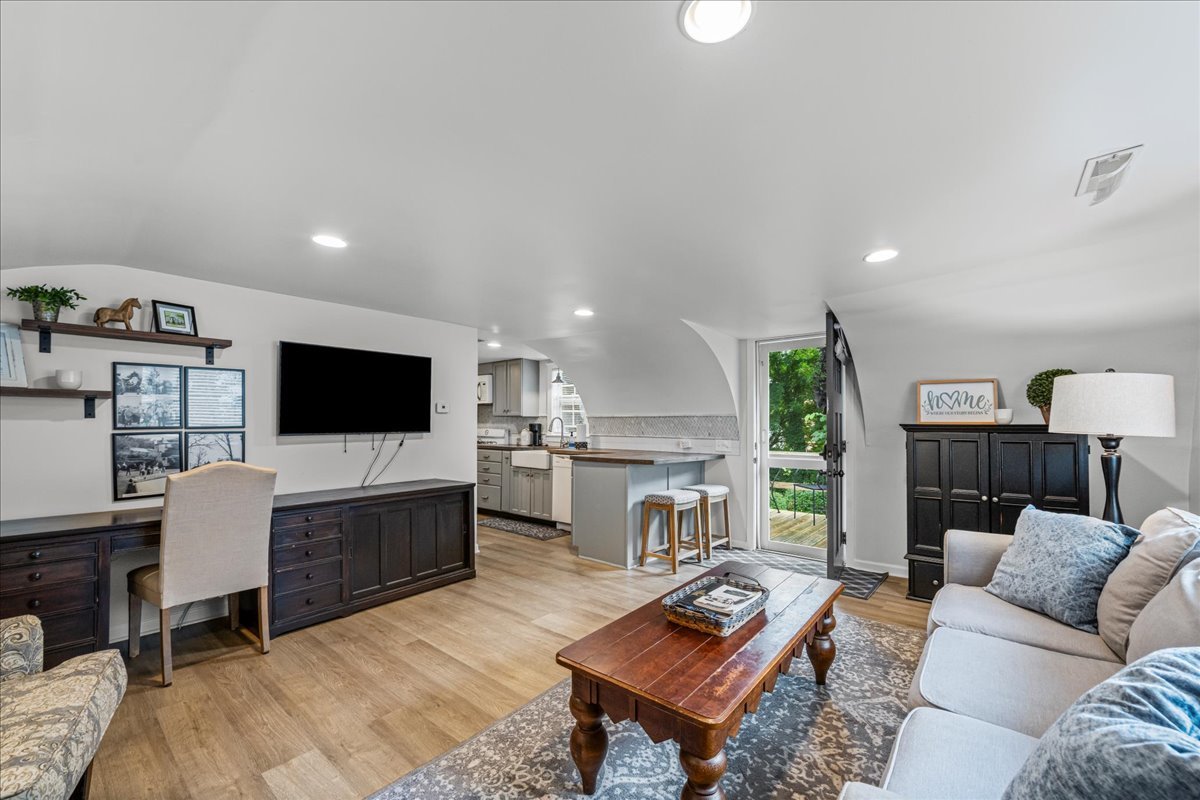 204 Country Commons Road Trout Valley, IL 60013 - Photo 30 of 58 a living room with furniture a flat screen tv and a refrigerator