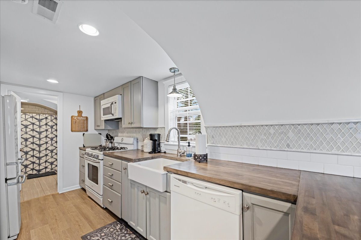 204 Country Commons Road Trout Valley, IL 60013 - Photo 32 of 58 a kitchen with a sink stove and cabinets