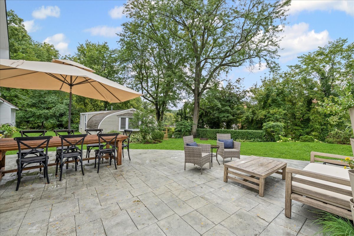 204 Country Commons Road Trout Valley, IL 60013 - Photo 35 of 58 an outdoor space with patio and white umbrellas