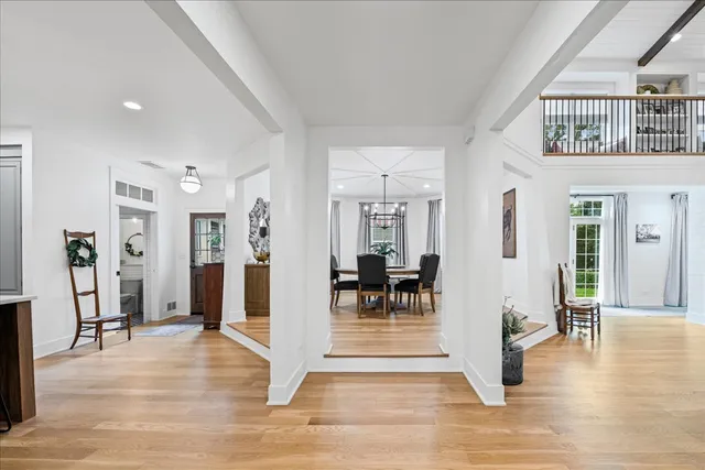 a living room with furniture or couch and a chandelier
