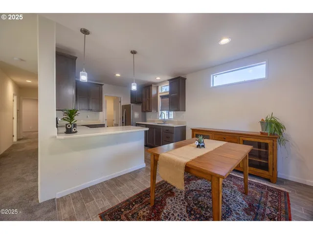 a kitchen with a table and chairs in it