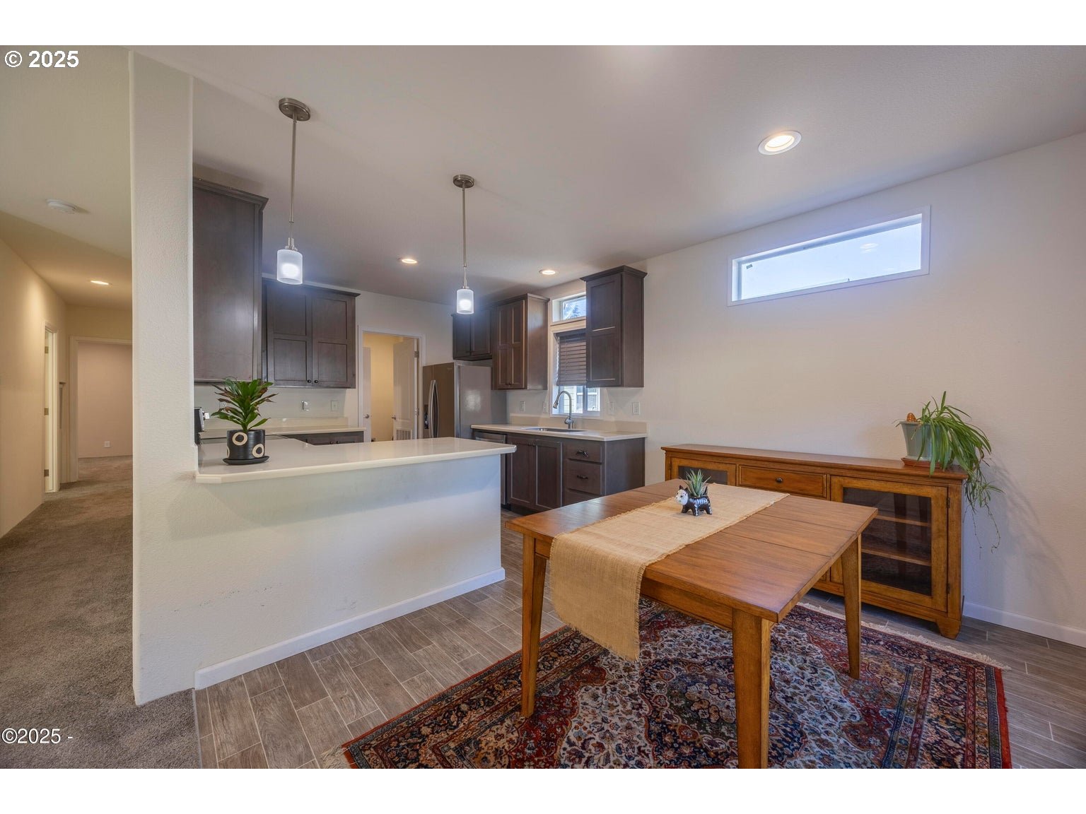 4875 Highway 101, Unit 3 Depoe Bay, OR 97341 - Photo 4 of 26 a kitchen with a table and chairs in it