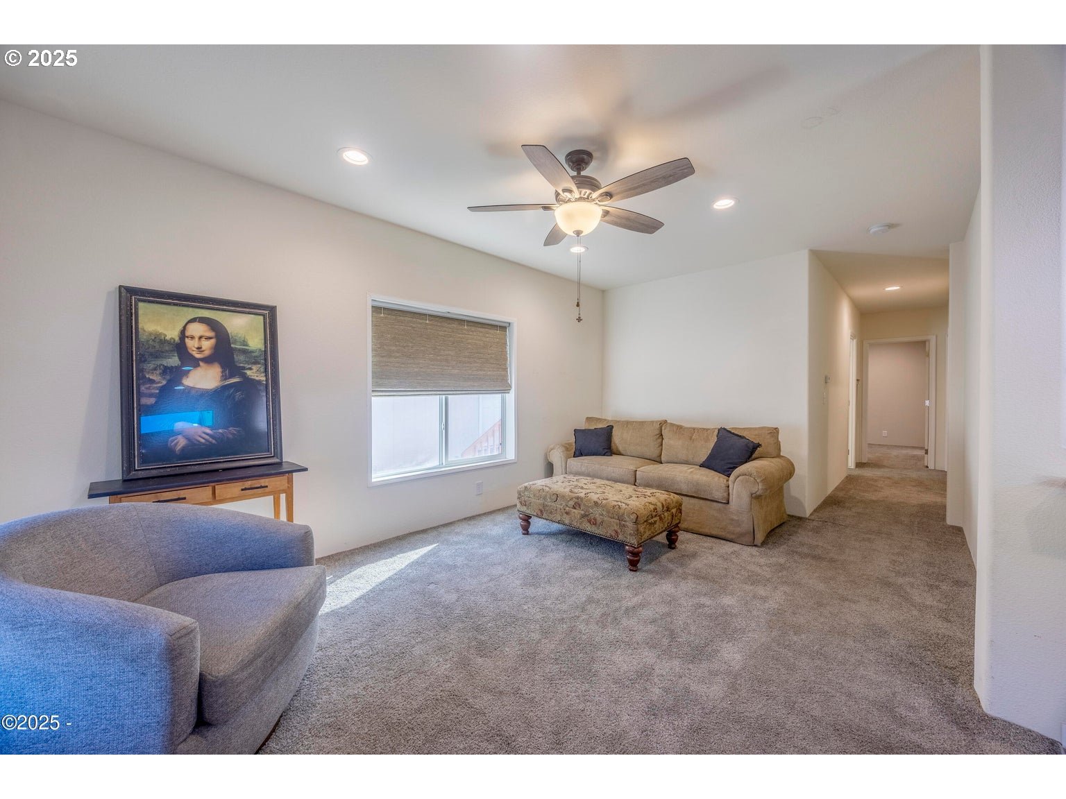 4875 Highway 101, Unit 3 Depoe Bay, OR 97341 - Photo 6 of 26 a living room with furniture and a ceiling fan