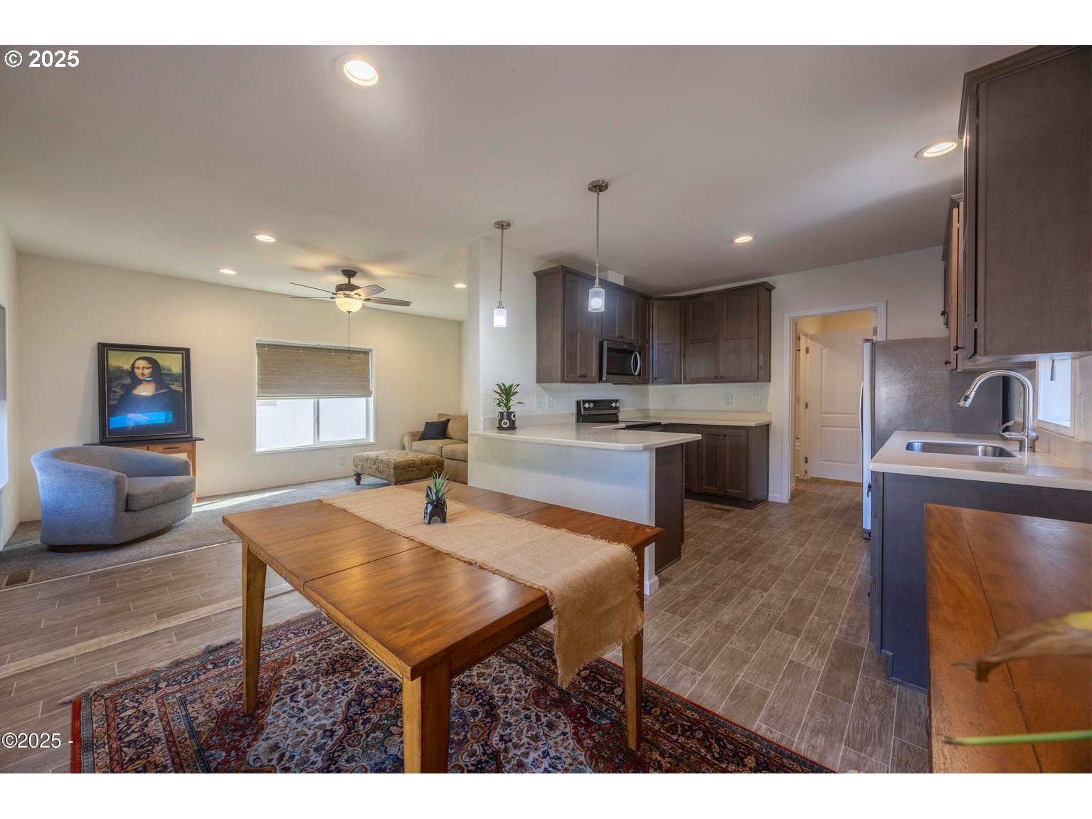 4875 Highway 101, Unit 3 Depoe Bay, OR 97341 - Photo 8 of 26 a kitchen with a table and chairs in it