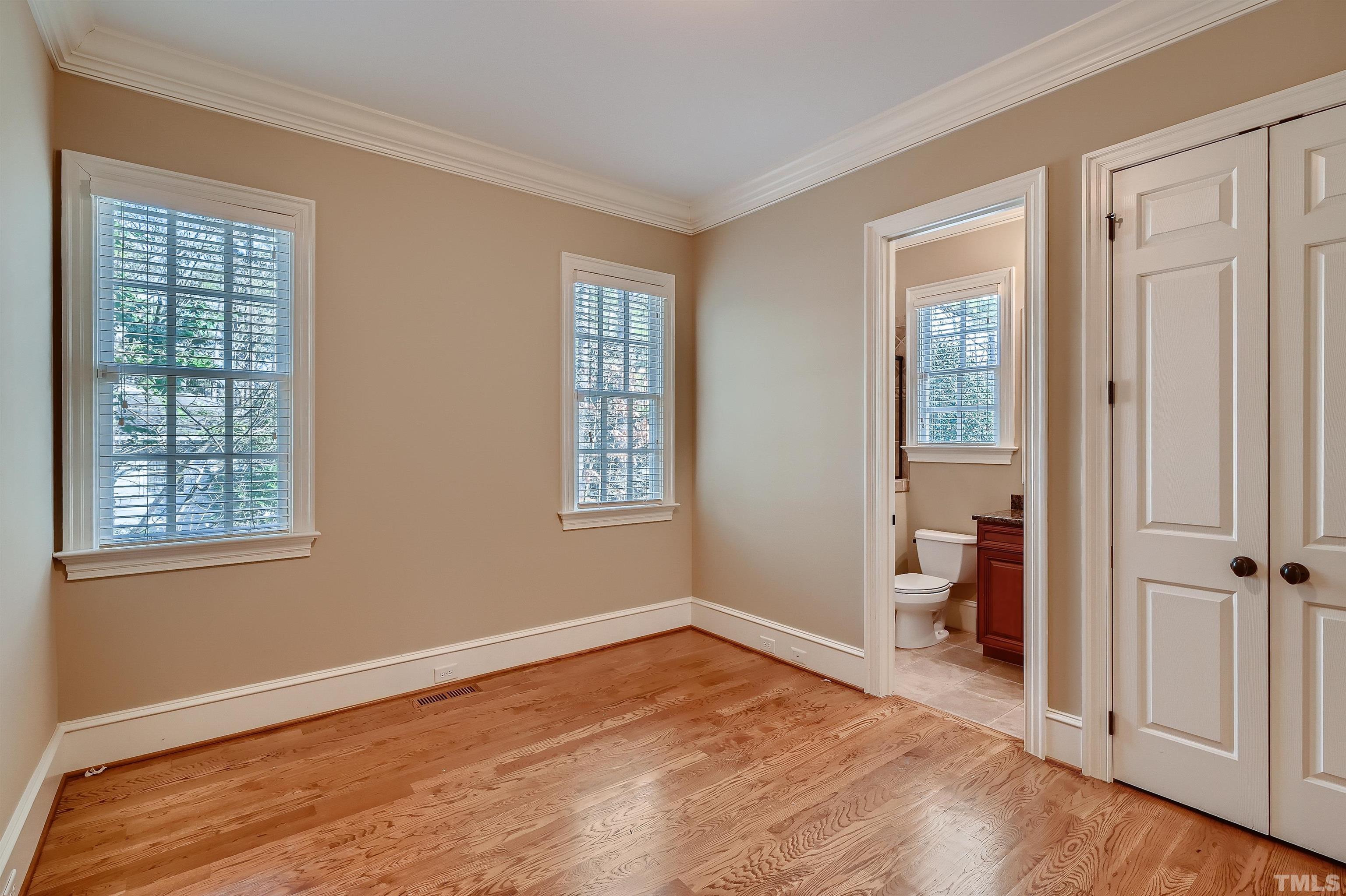 2714 Rosedale Avenue Raleigh, NC 27607 - Photo 12 of 28 a view of empty room with wooden floor and fan