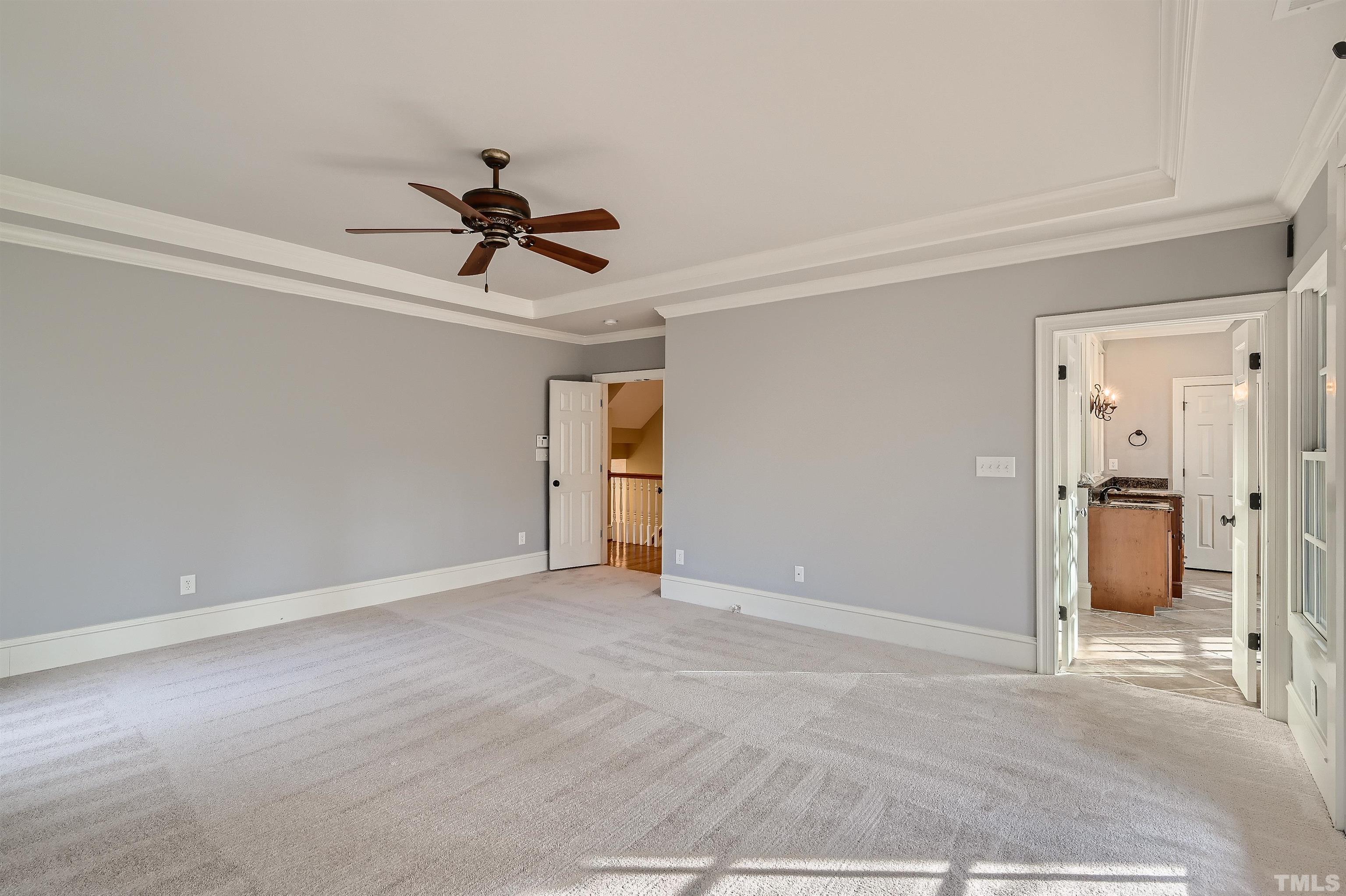 2714 Rosedale Avenue Raleigh, NC 27607 - Photo 14 of 28 a view of a livingroom with a chandelier fan and windows