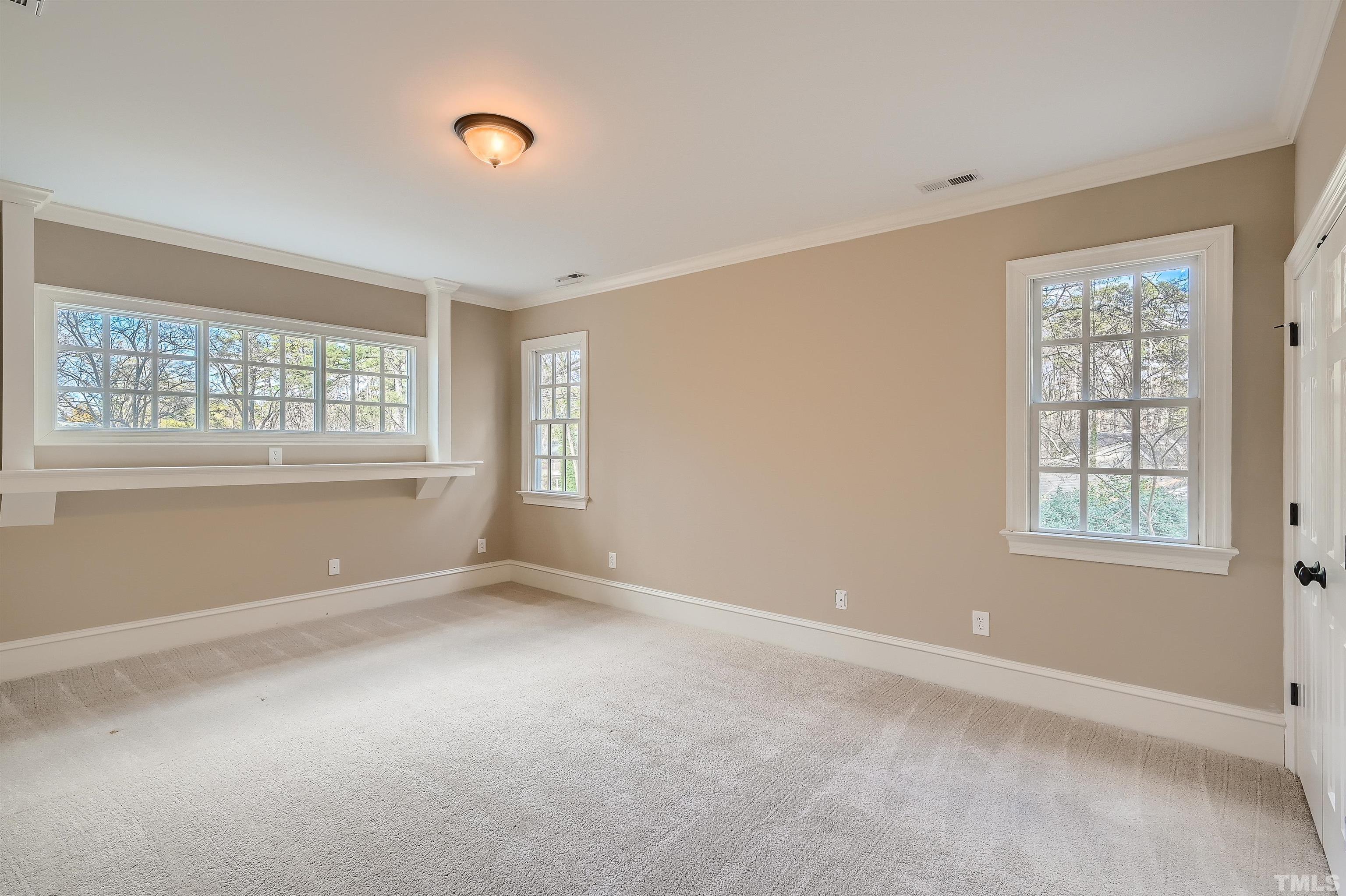 2714 Rosedale Avenue Raleigh, NC 27607 - Photo 20 of 28 an empty room with windows