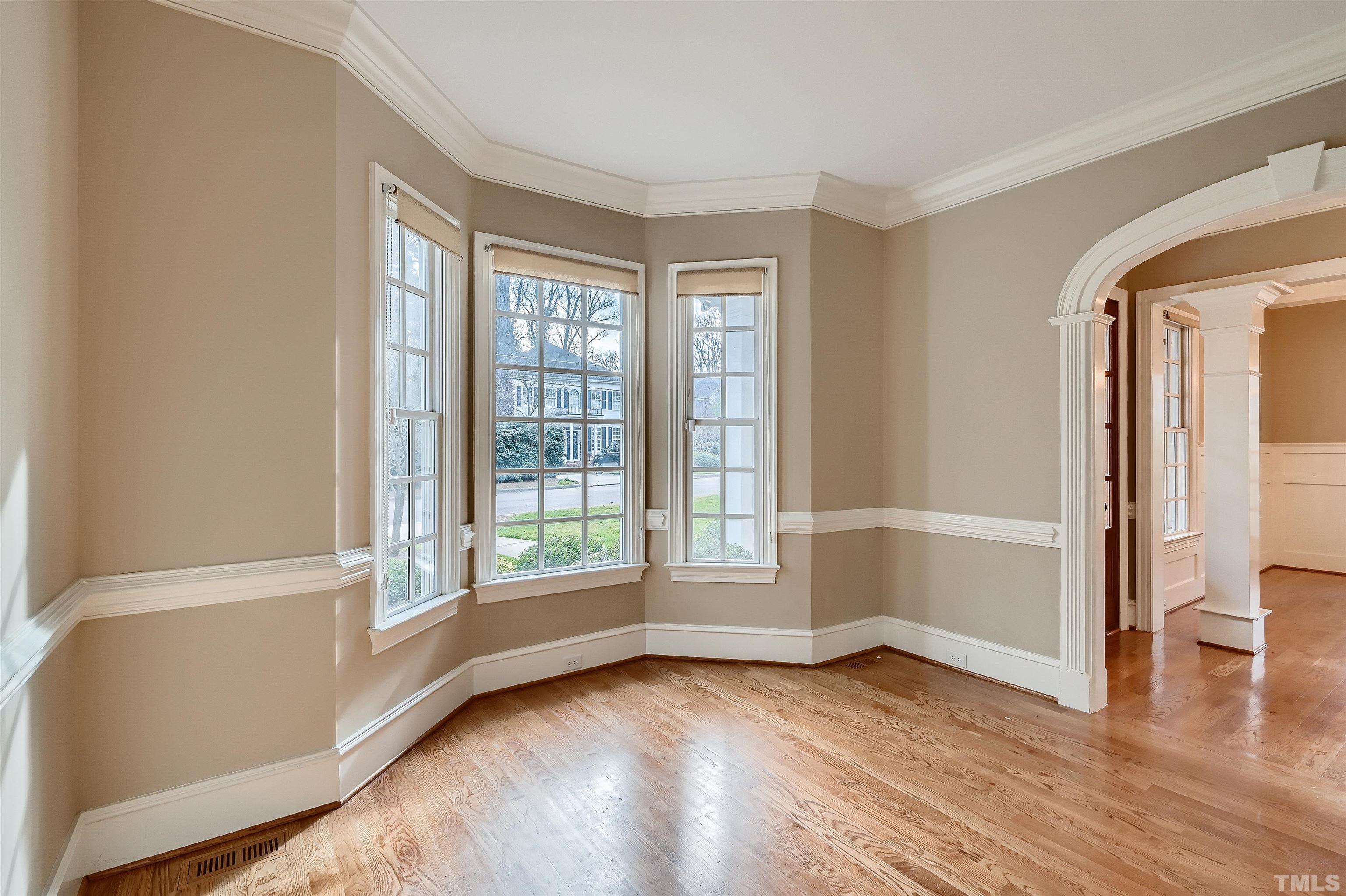 2714 Rosedale Avenue Raleigh, NC 27607 - Photo 4 of 28 an empty room with wooden floor and windows