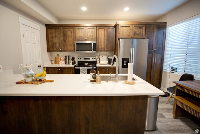 983 South 950 West Provo, UT 84601 - Photo 29 of 56 Spacious kitchen featuring a large island with a stainless steel sink and faucet