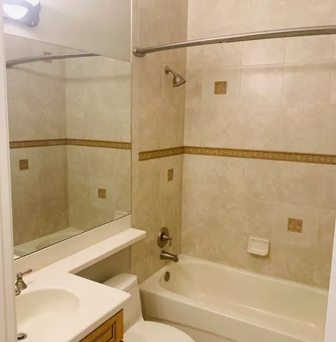 a bathroom with a shower and a bath tub
