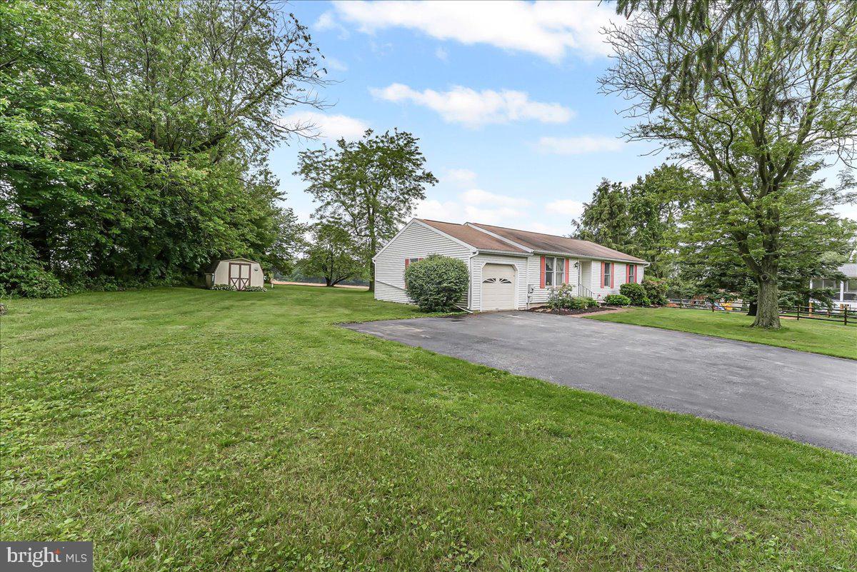 252 Althouse Road Cochranville, PA 19330 - Photo 1 of 28 a front view of house with yard and green space