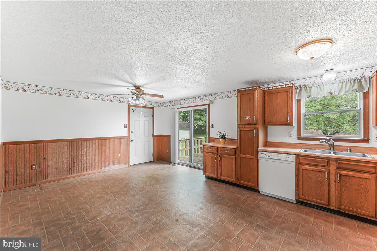 252 Althouse Road Cochranville, PA 19330 - Photo 11 of 28 a large kitchen with kitchen island granite countertop a sink stainless steel appliances and cabinets