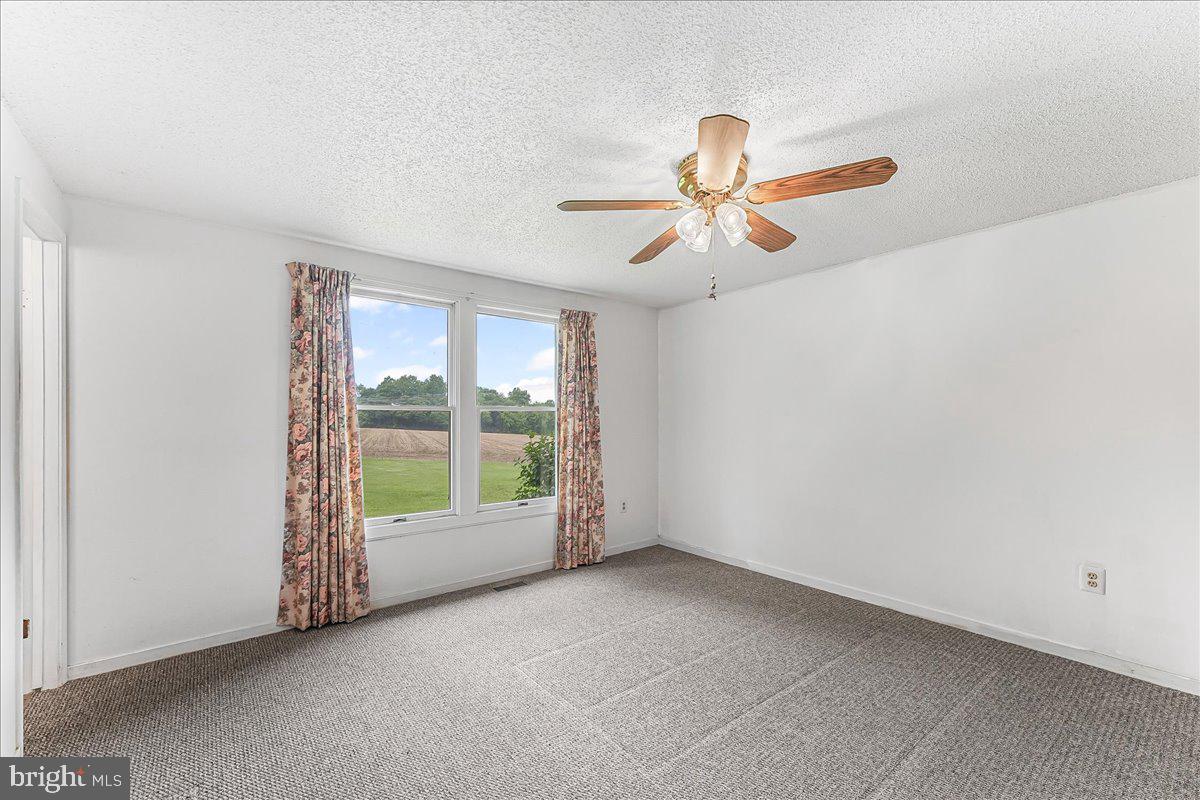 252 Althouse Road Cochranville, PA 19330 - Photo 16 of 28 a view of an empty room with a window