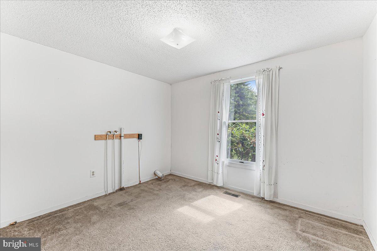 252 Althouse Road Cochranville, PA 19330 - Photo 19 of 28 an empty room with windows