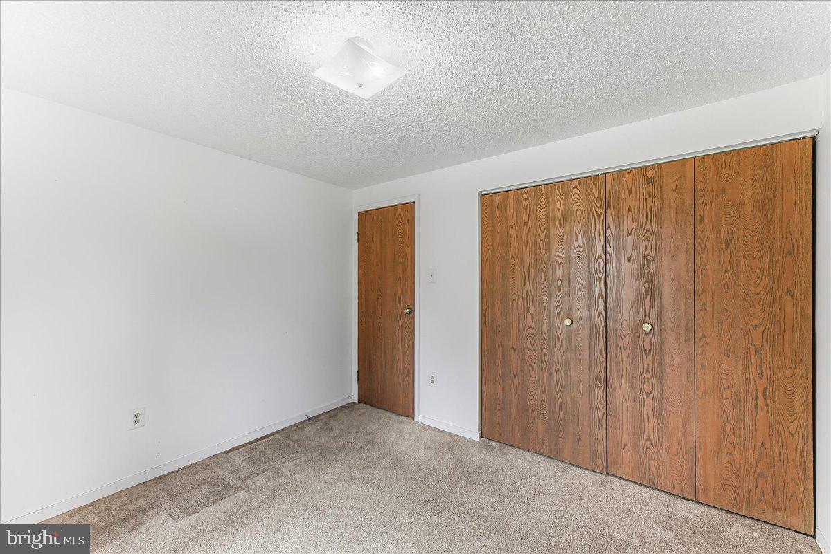252 Althouse Road Cochranville, PA 19330 - Photo 20 of 28 a view of an empty room with wooden floor