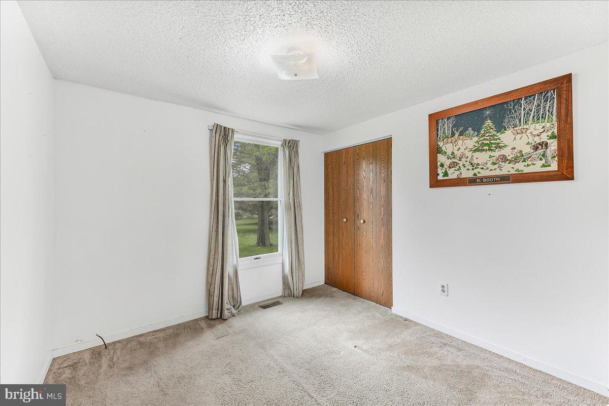 252 Althouse Road Cochranville, PA 19330 - Photo 21 of 28 an empty room with windows