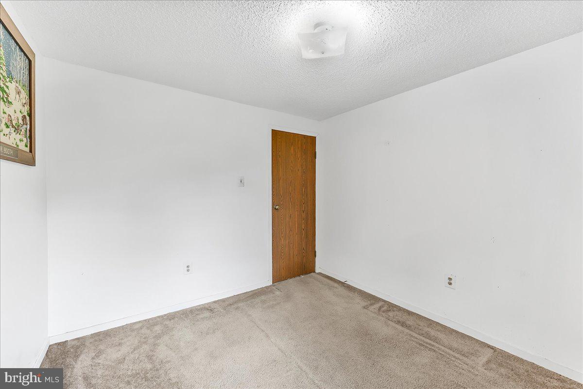 252 Althouse Road Cochranville, PA 19330 - Photo 22 of 28 an empty room with a empty space