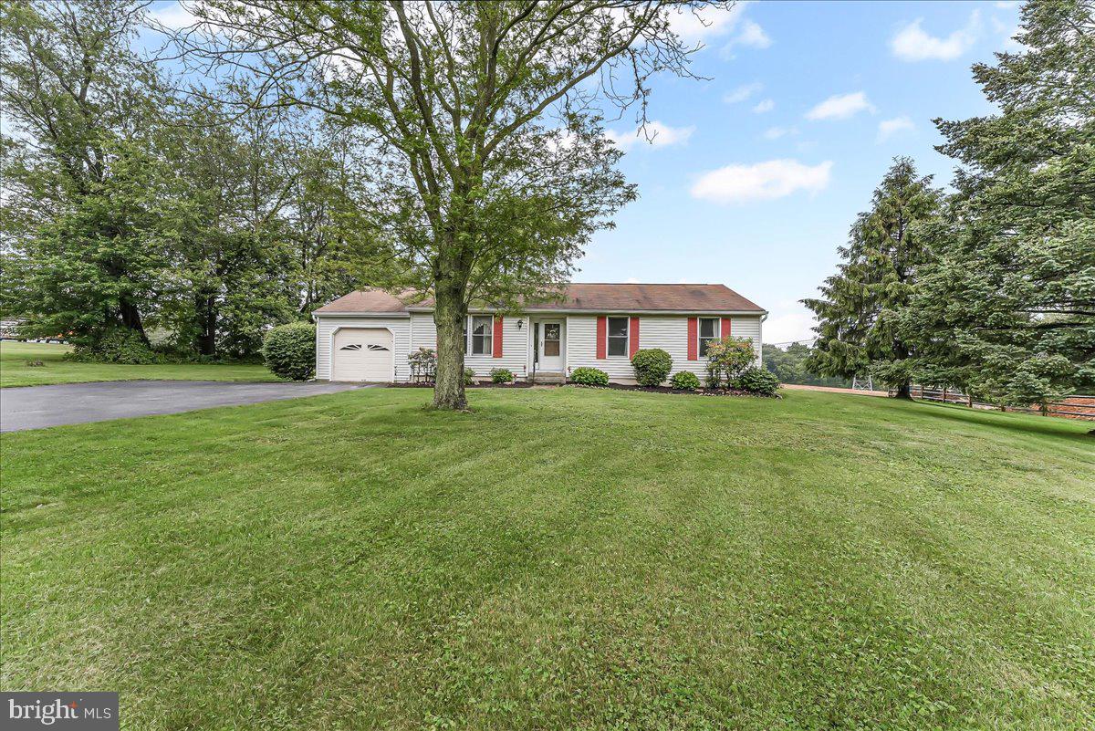 252 Althouse Road Cochranville, PA 19330 - Photo 3 of 28 a house view with garden space and trees