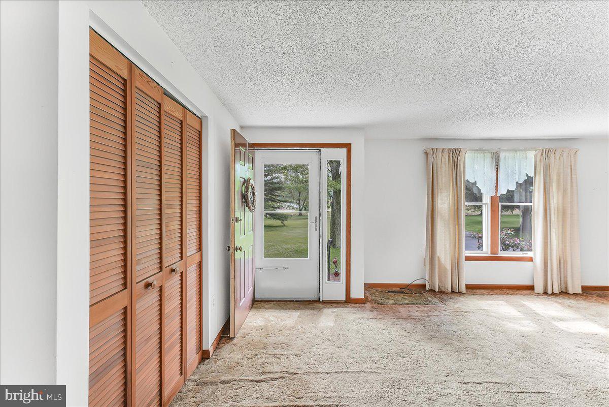 252 Althouse Road Cochranville, PA 19330 - Photo 5 of 28 an empty room with windows
