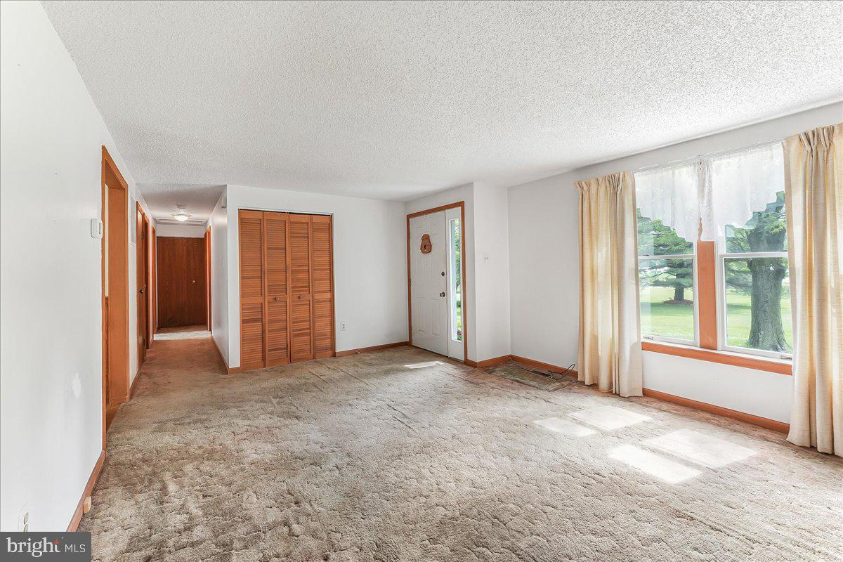 252 Althouse Road Cochranville, PA 19330 - Photo 8 of 28 an empty room with windows and closet