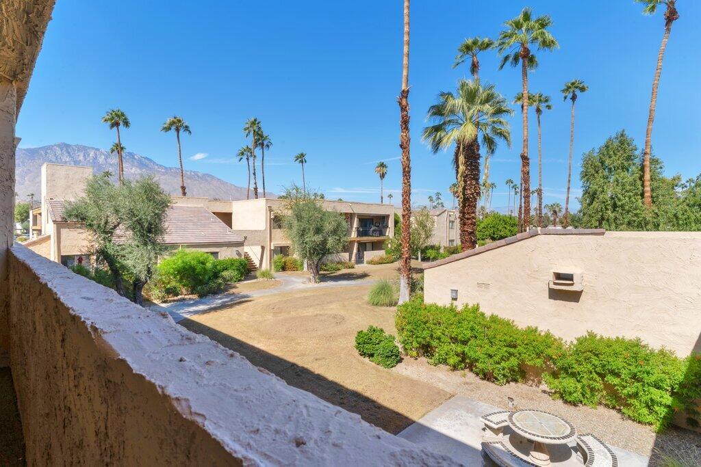 5300 East Waverly Drive, Unit 4209 Palm Springs, CA 92264 - Photo 12 of 13 a view of a house with a yard and potted plants