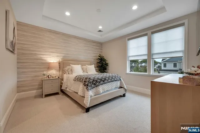 a view of a house with a yard and potted plants