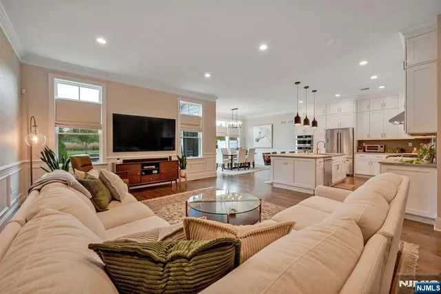 a living room with furniture and a lamp