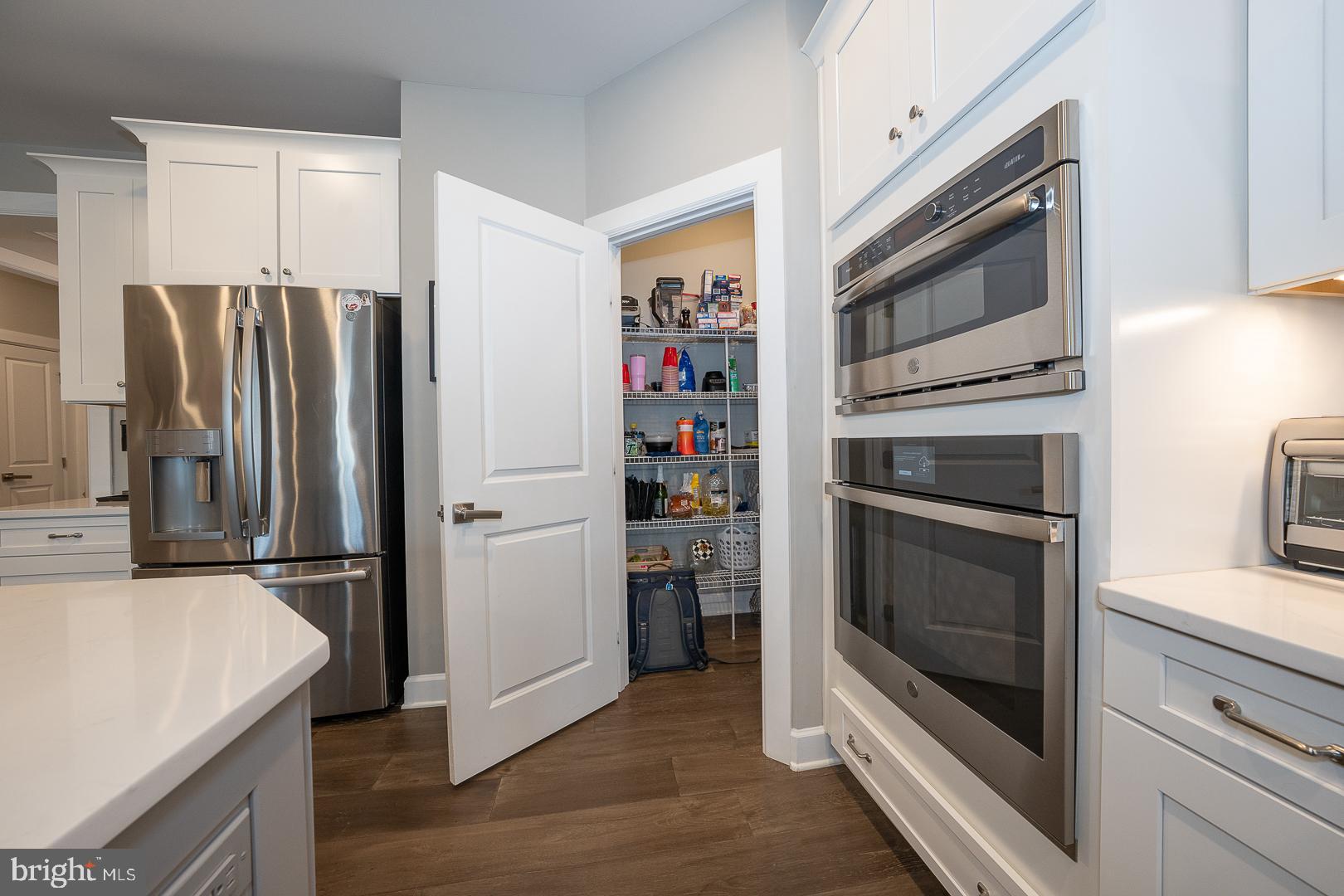 302 AP Even Road Wayne, PA 19087 - Photo 7 of 41 a kitchen with stainless steel appliances granite countertop a refrigerator and a stove top oven