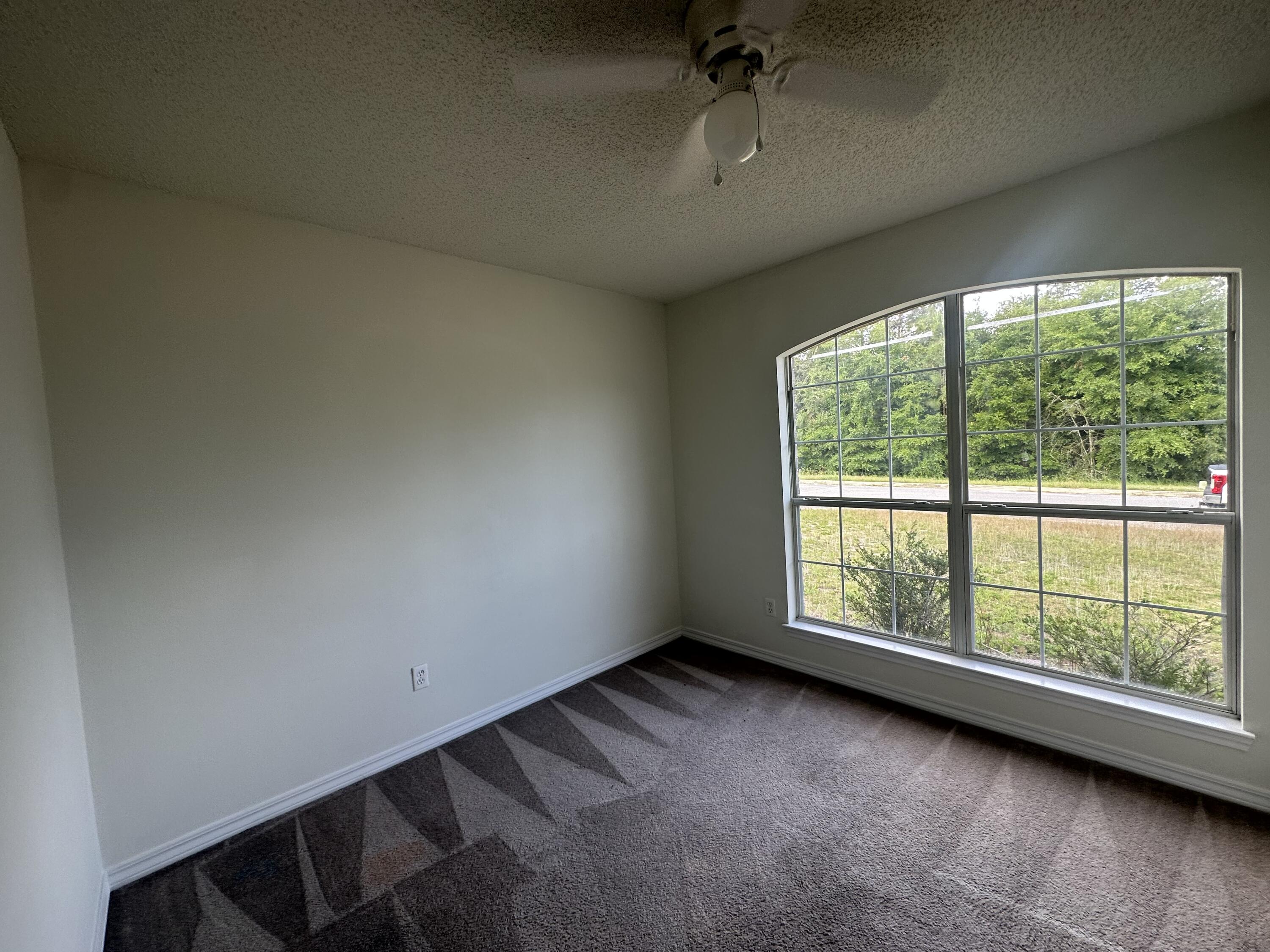 136 Sandstone Trail Crestview, FL 32539 - Photo 11 of 17 an empty room with a window