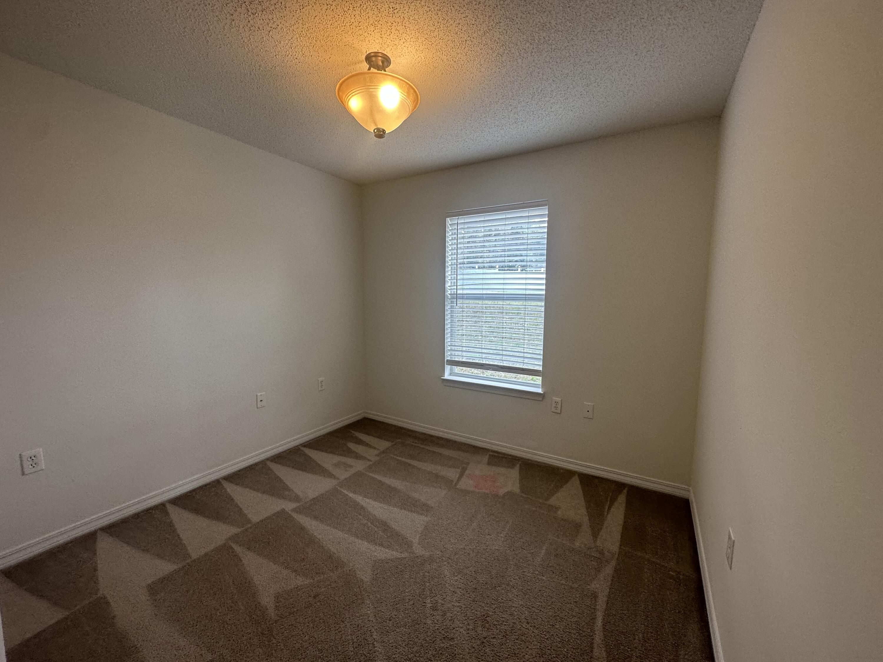 136 Sandstone Trail Crestview, FL 32539 - Photo 13 of 17 an empty room with a window