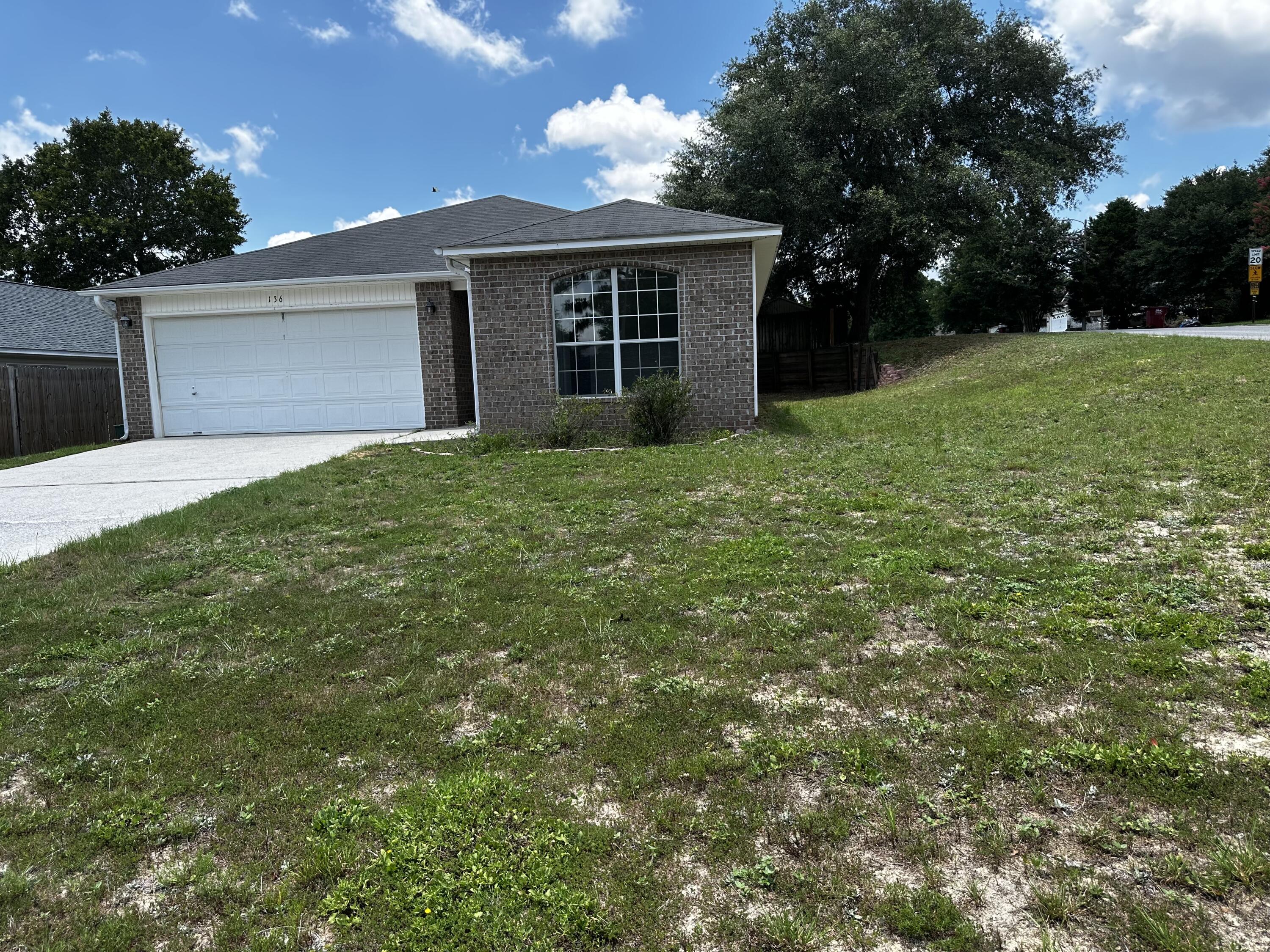 136 Sandstone Trail Crestview, FL 32539 - Photo 2 of 17 front view of a house with a yard