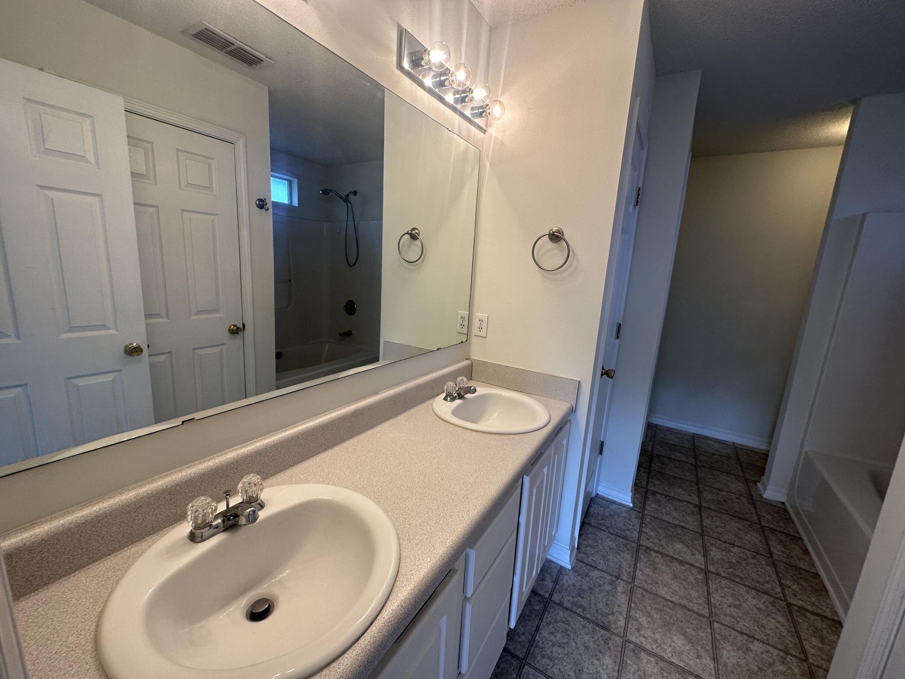 136 Sandstone Trail Crestview, FL 32539 - Photo 7 of 17 a bathroom with a sink and a mirror