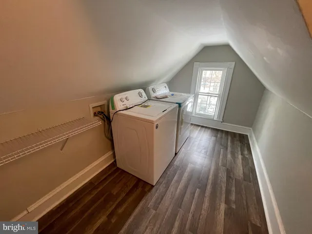 a utility room with closet dryer and washer