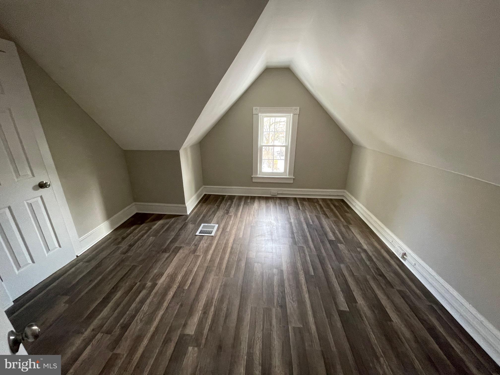 10 Clifton Avenue, Unit B Merchantville, NJ 08109 - Photo 17 of 20 a view of empty room with wooden floor and fan