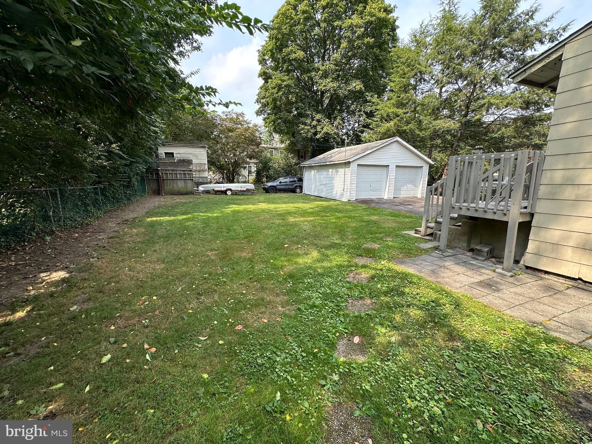 10 Clifton Avenue, Unit B Merchantville, NJ 08109 - Photo 20 of 20 a view of a backyard with a garden and trees