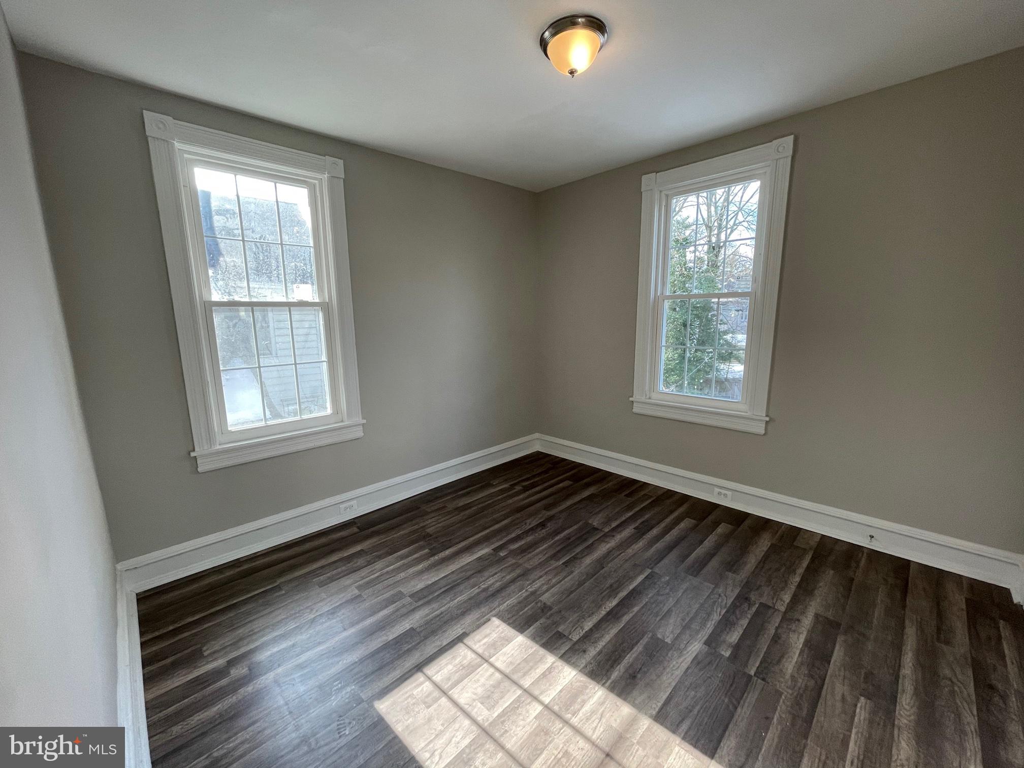 10 Clifton Avenue, Unit B Merchantville, NJ 08109 - Photo 8 of 20 a view of an empty room and window