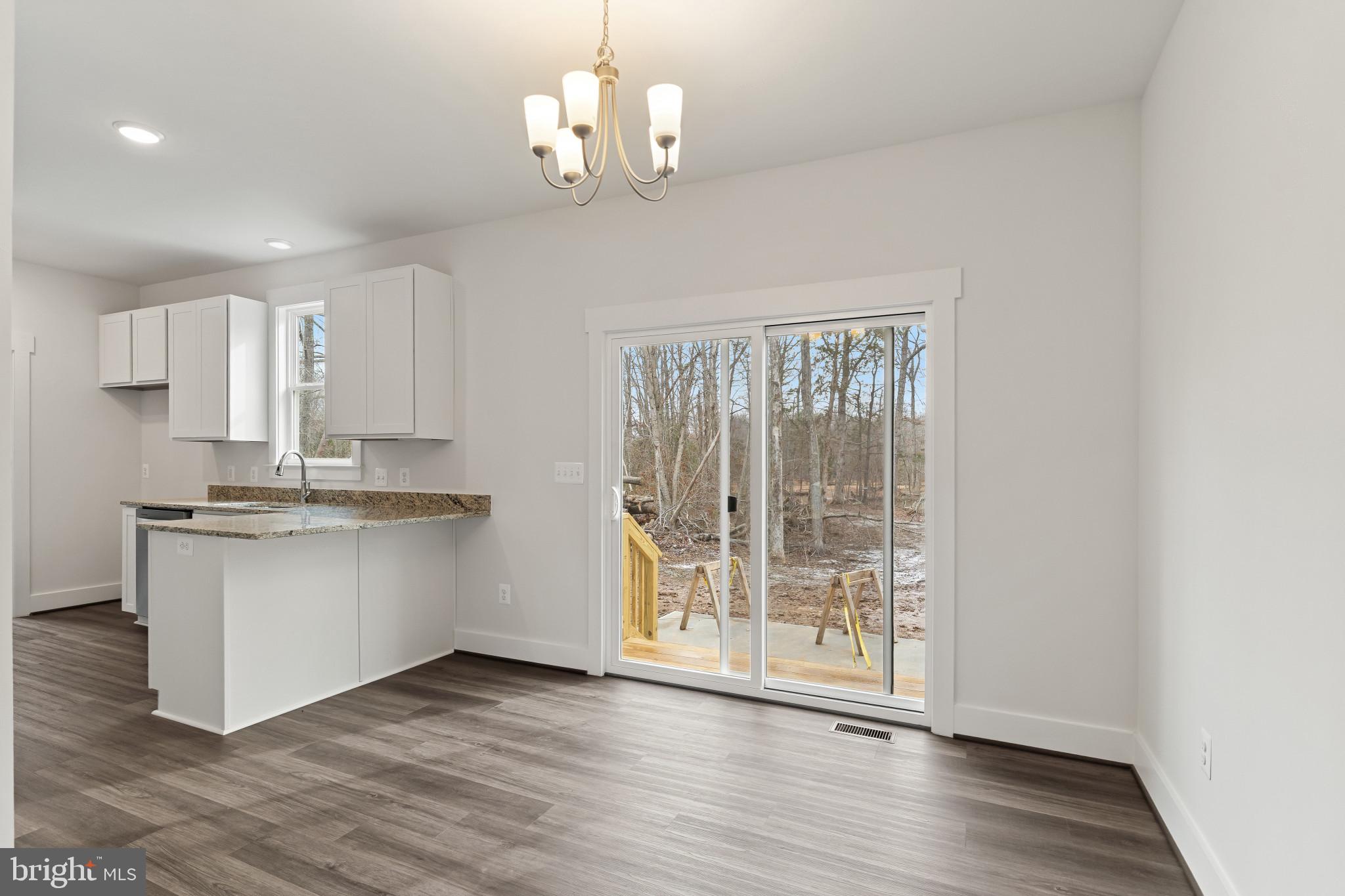 6735 Beverly Road Broad Run, VA 20137 - Photo 10 of 30 Kitchen with white cabinetry, light stone counters