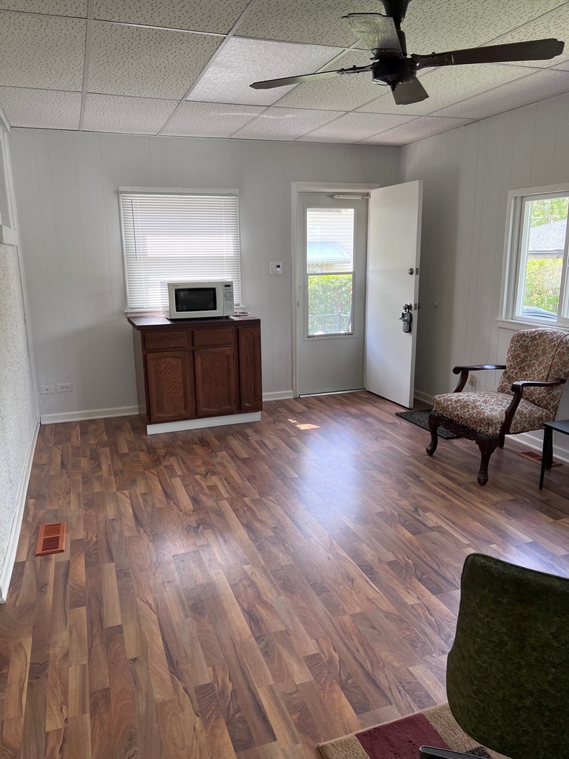 184 Waubansee Road Riverside, IL 60546 - Photo 29 of 38 a view of empty room with wooden floor and fan