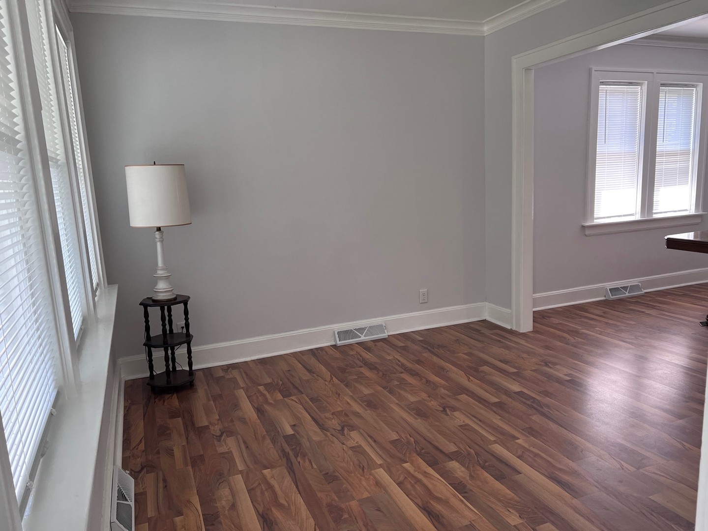 184 Waubansee Road Riverside, IL 60546 - Photo 6 of 38 a view of an empty room with wooden floor and a window