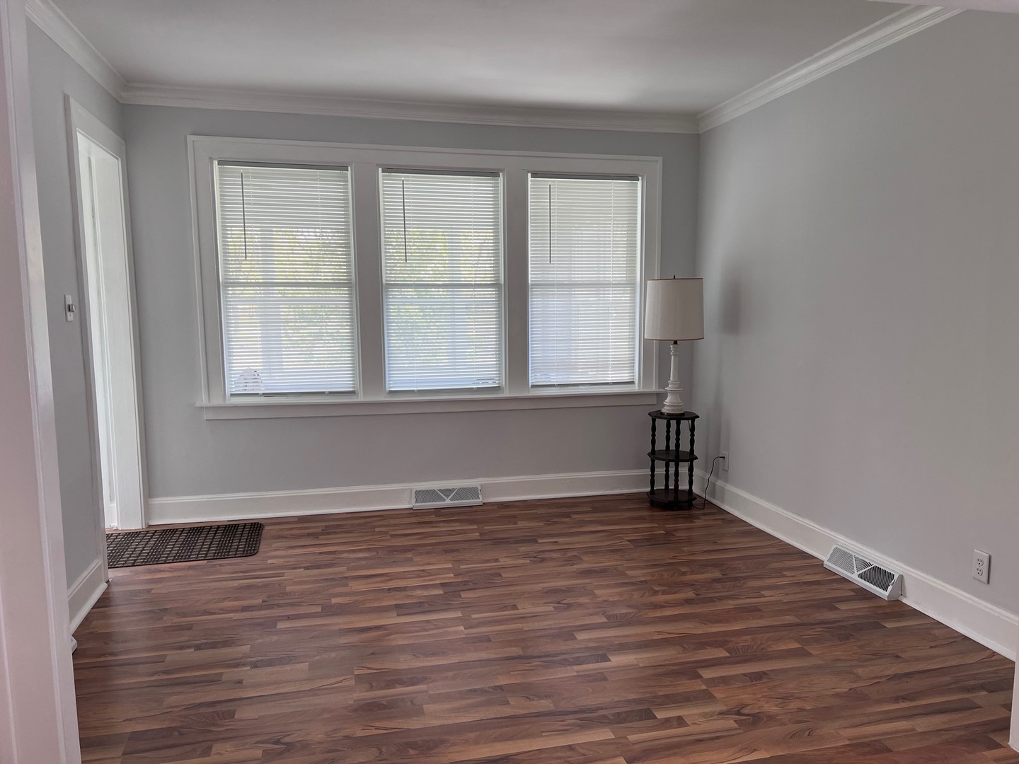 184 Waubansee Road Riverside, IL 60546 - Photo 7 of 38 wooden floor in an empty room with a window