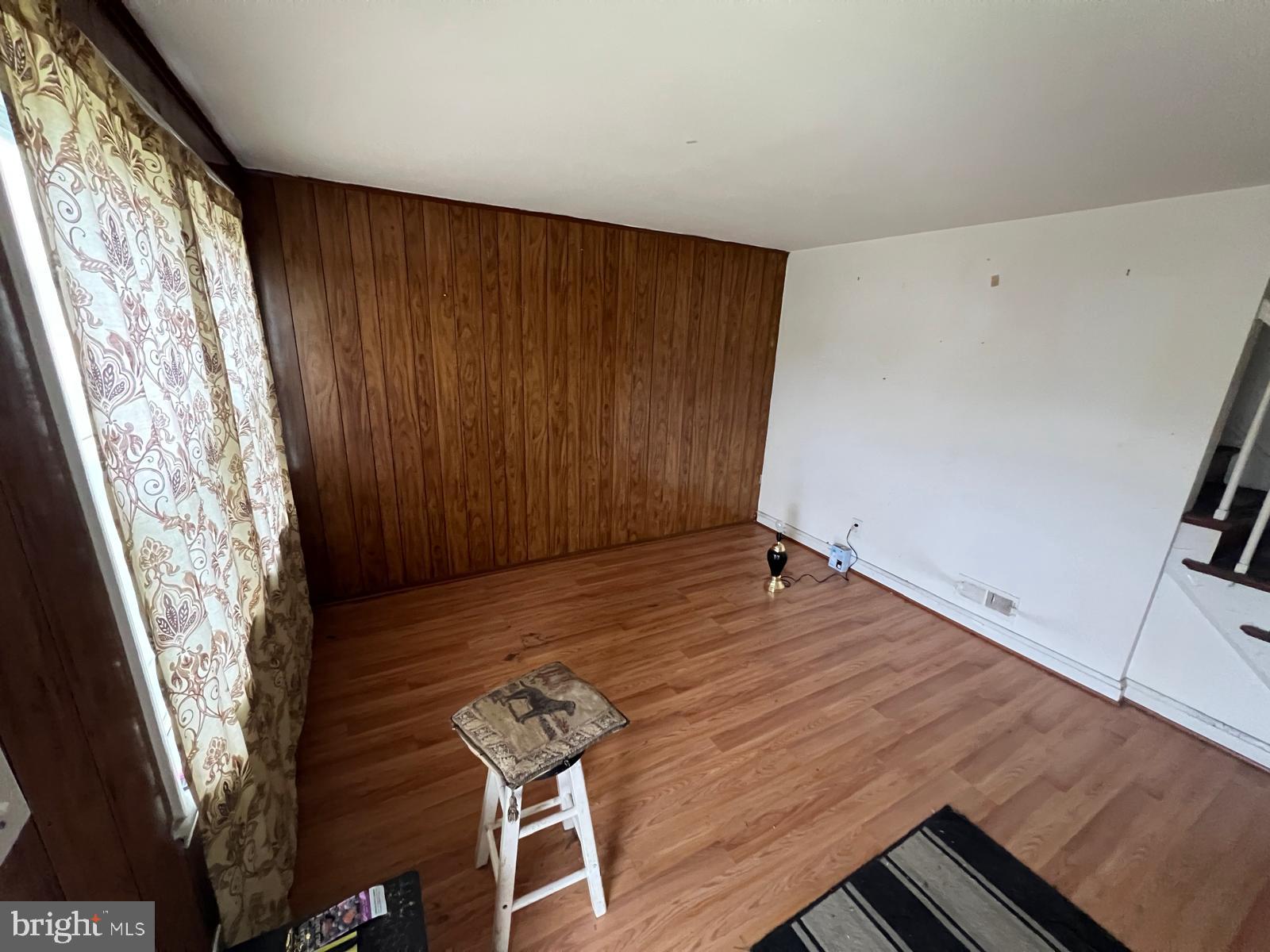 3917 Dudley Avenue Baltimore, MD 21213 - Photo 15 of 65 a view of a room with wooden floor