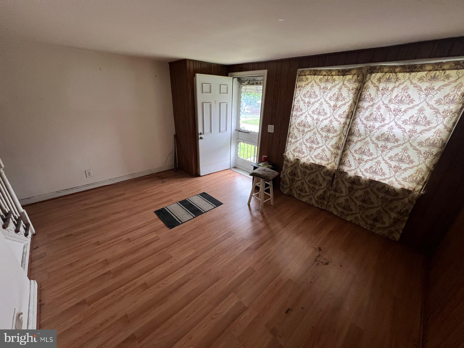 3917 Dudley Avenue Baltimore, MD 21213 - Photo 17 of 65 a room with wooden floor and a window